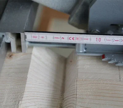 Ajuste del tope paralelo para cortar en el lado de corte